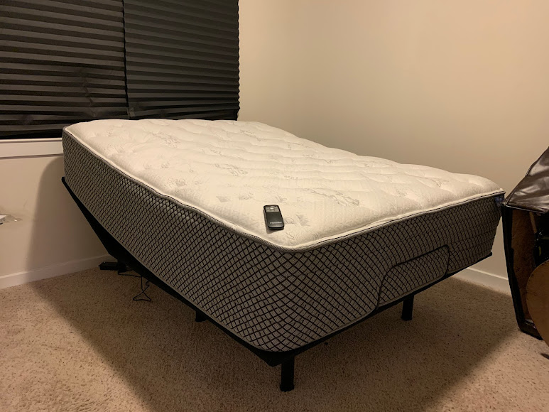 Adjustable base with the mattress raised at the head, on display in the showroom