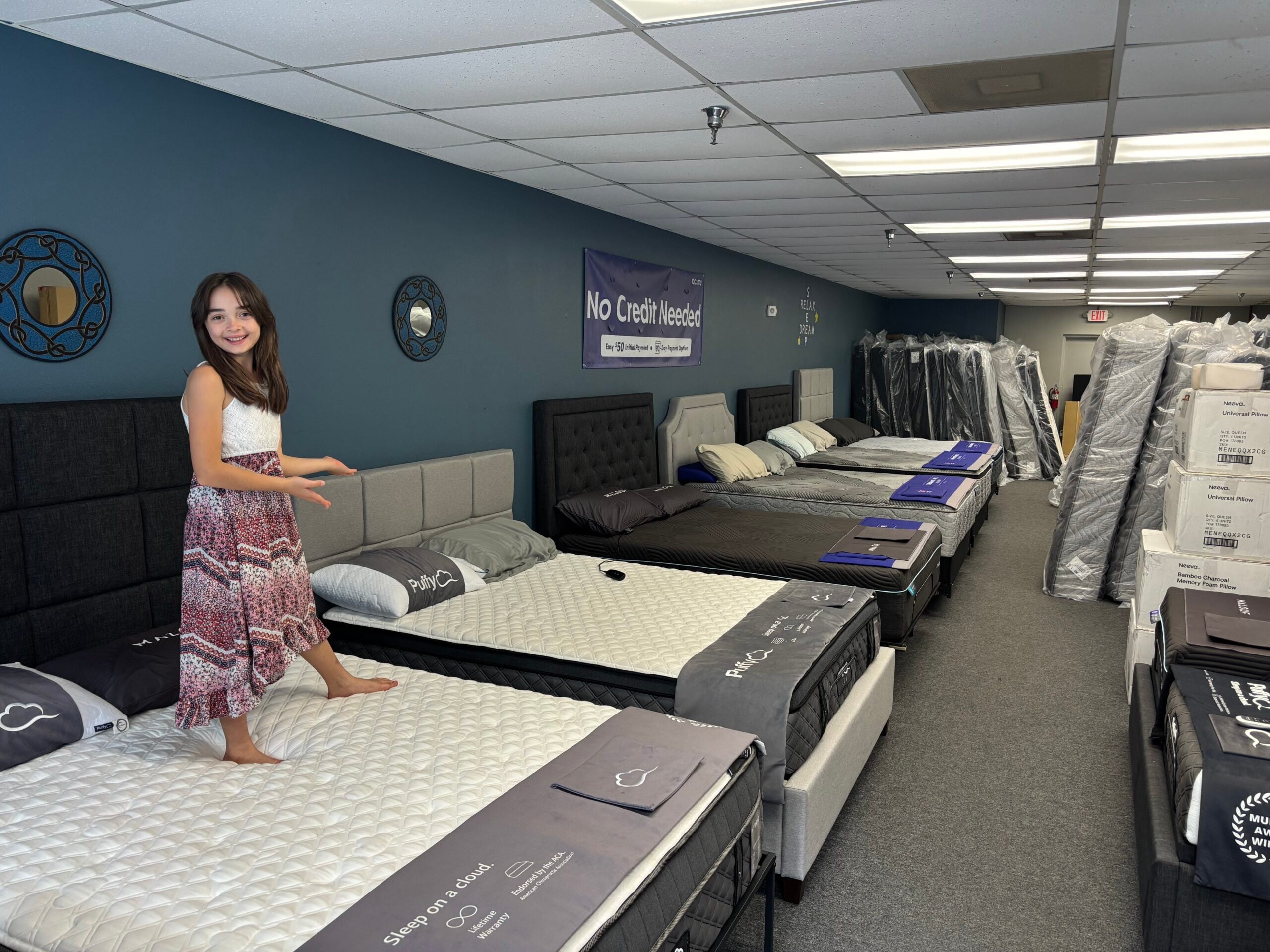 Customer walking the showroom floor at Mattress Direct in Oviedo, near Casselberry